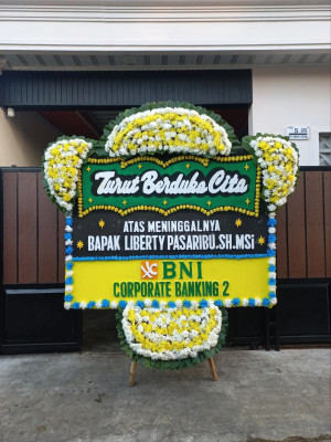 Papan Bunga Duka di Woniki