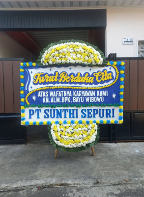 Papan Bunga Duka di Woniki