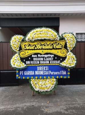 Papan Bunga Duka di Woniki