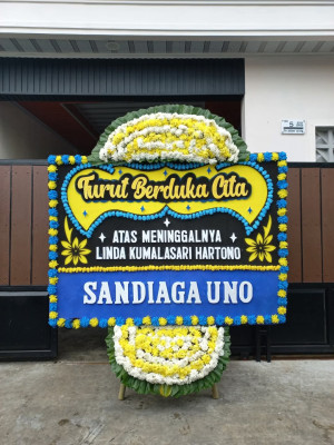 Papan Bunga Duka di Woniki